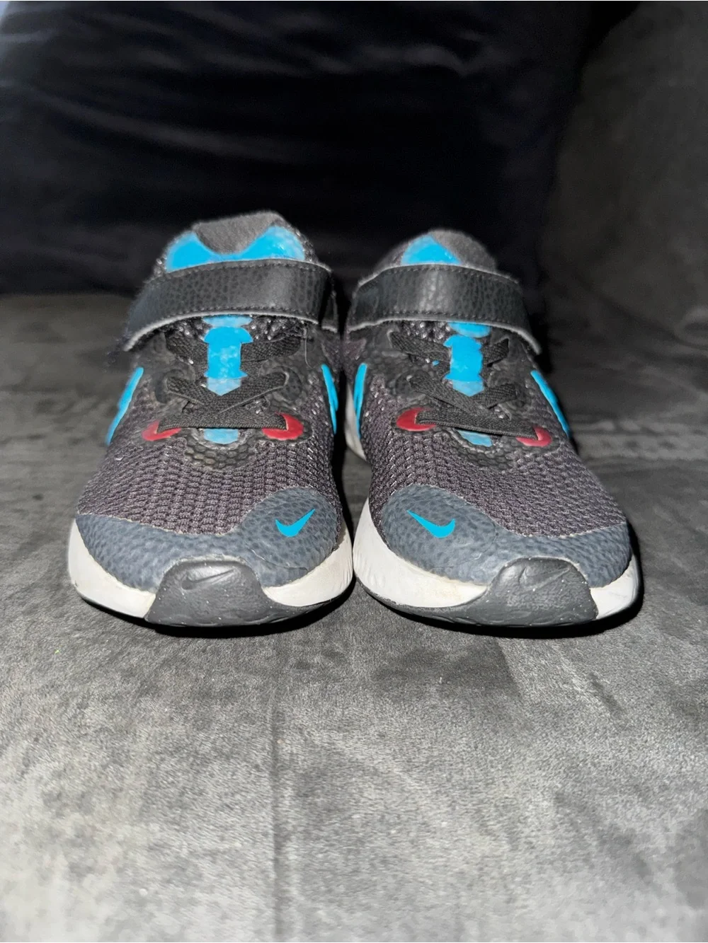Renew Nike Kids size 13. Running Black Sneakers with Blue and neon pink .